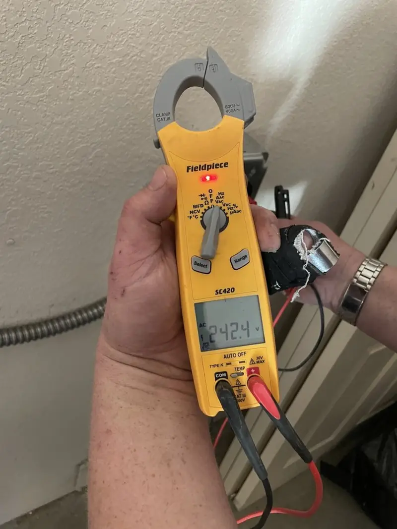 Voltage testing with clamp meter during Recessed Lighting Installation in Riviera Beach